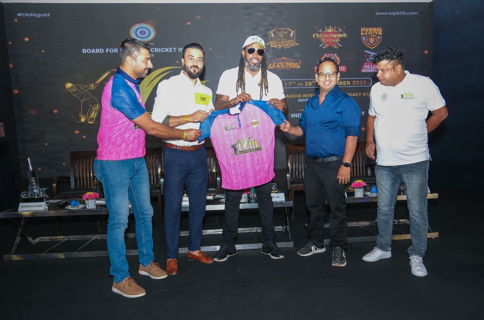 Founders with international stars at a veterans' league jersey presentation.
