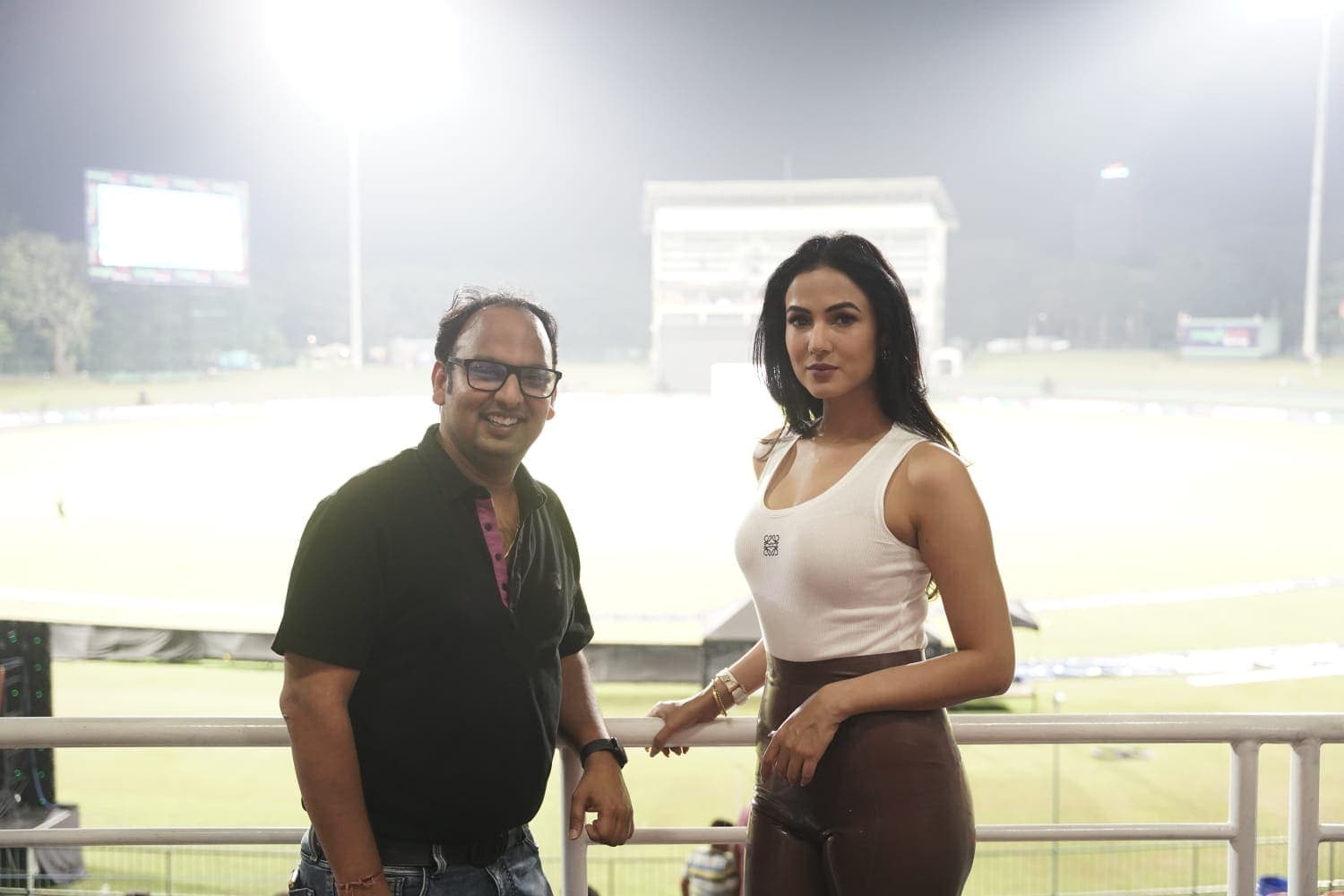 Rohit Bawri with a guest at the stadium in the evening.